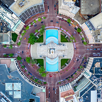 An aerial shot and birdseye view of Monument Circle and the Soldiers and Sailor Monument in downtown Indianapolis.