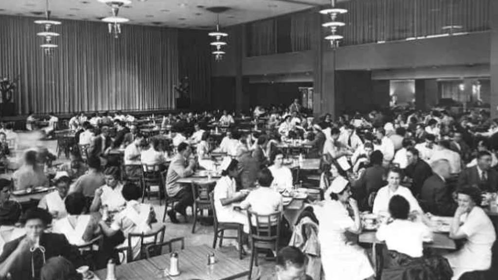 Students fill the tables of the Student Union Building cafeteria during a meal.