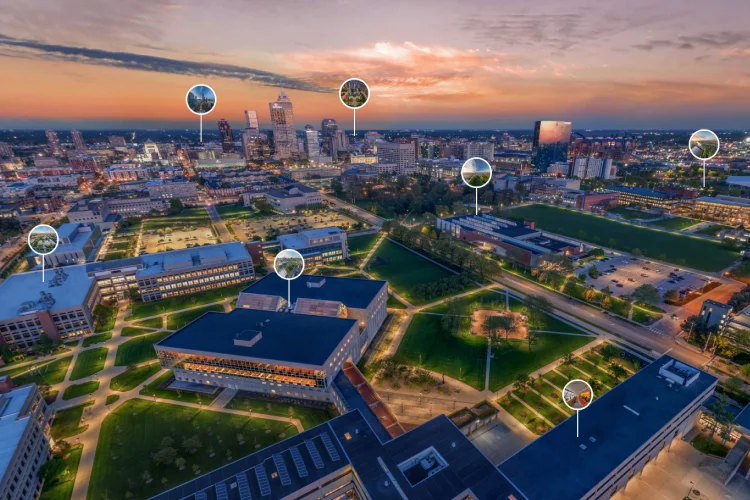 An aerial image of downtown Indianapolis at sunset with circle labels pointing down to IU Indianapolis campus buildings.