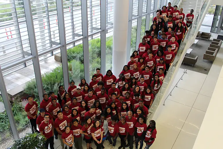 Crowd of Norman Brown scholars on staircase