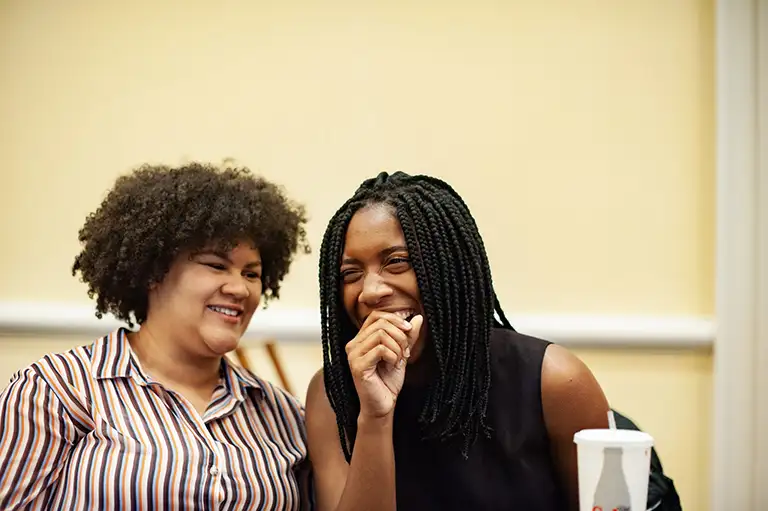 Two Norman Brown scholars laughing together