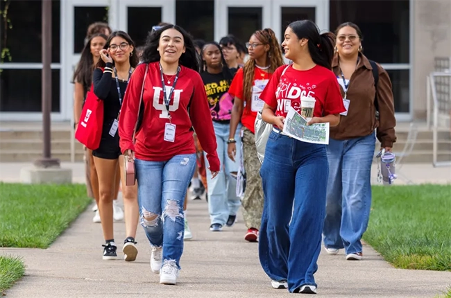 A group of students in IU gear tour the IU Indy campus.